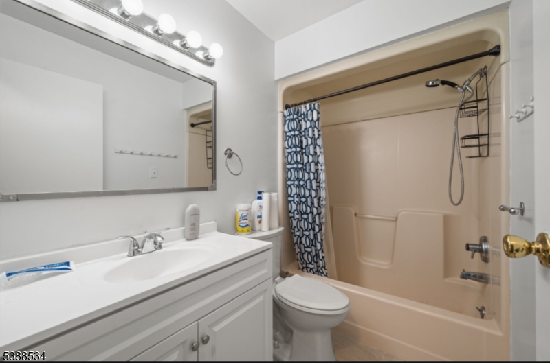 136 Haroldson Place Pompton Lakes, NJ 07442 - Photo 20 of 23 a bathroom with a sink a toilet and shower