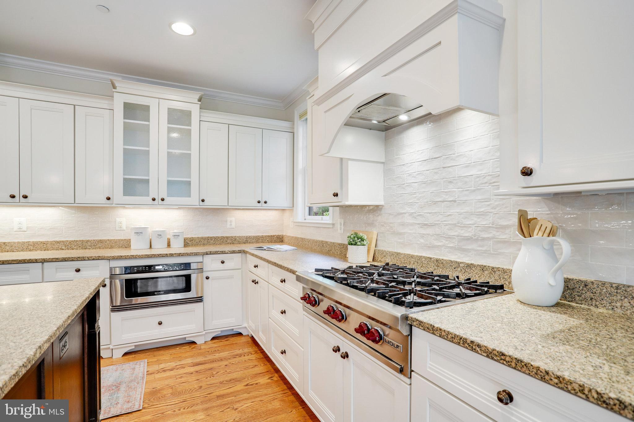 6108 Landon Lane Bethesda, MD 20817 - Photo 24 of 74 Kitchen w/ Wolf 6-Burner Cooktop