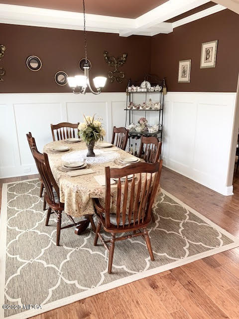 203 Longbridge Way Perry, GA 31069 - Photo 11 of 31 a view of a dining room with furniture and wooden floor