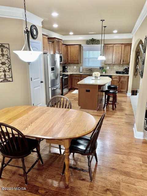 203 Longbridge Way Perry, GA 31069 - Photo 12 of 31 a large kitchen with a table and chairs