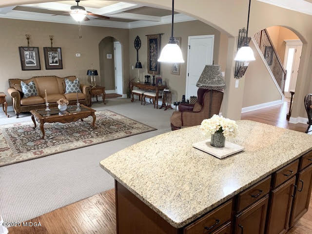 203 Longbridge Way Perry, GA 31069 - Photo 15 of 31 a living room with granite countertop kitchen island furniture and a chandelier