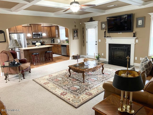 203 Longbridge Way Perry, GA 31069 - Photo 17 of 31 a living room with furniture and a fireplace