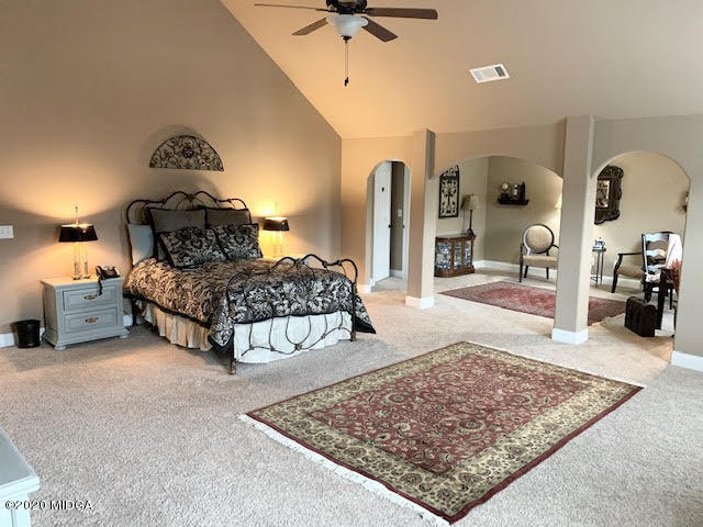 203 Longbridge Way Perry, GA 31069 - Photo 18 of 31 a bedroom with bed and a chandelier