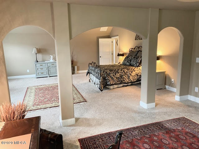 203 Longbridge Way Perry, GA 31069 - Photo 20 of 31 a bed room with a bed and a painting on the wall