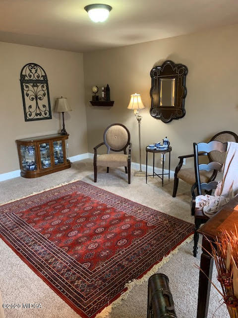203 Longbridge Way Perry, GA 31069 - Photo 22 of 31 a living room with furniture rug and window