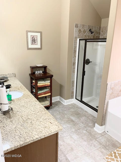 203 Longbridge Way Perry, GA 31069 - Photo 23 of 31 a view of a livingroom with wooden floor and a refrigerator