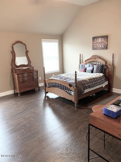 203 Longbridge Way Perry, GA 31069 - Photo 26 of 31 a bedroom with a bed and a tv
