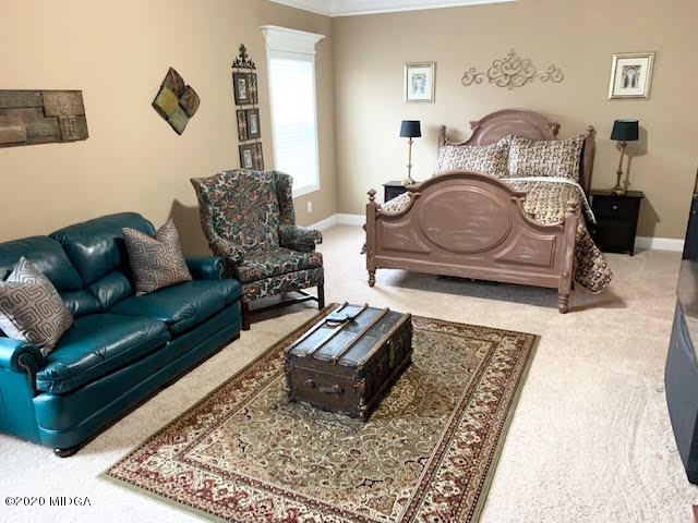 203 Longbridge Way Perry, GA 31069 - Photo 29 of 31 a living room with furniture and a rug