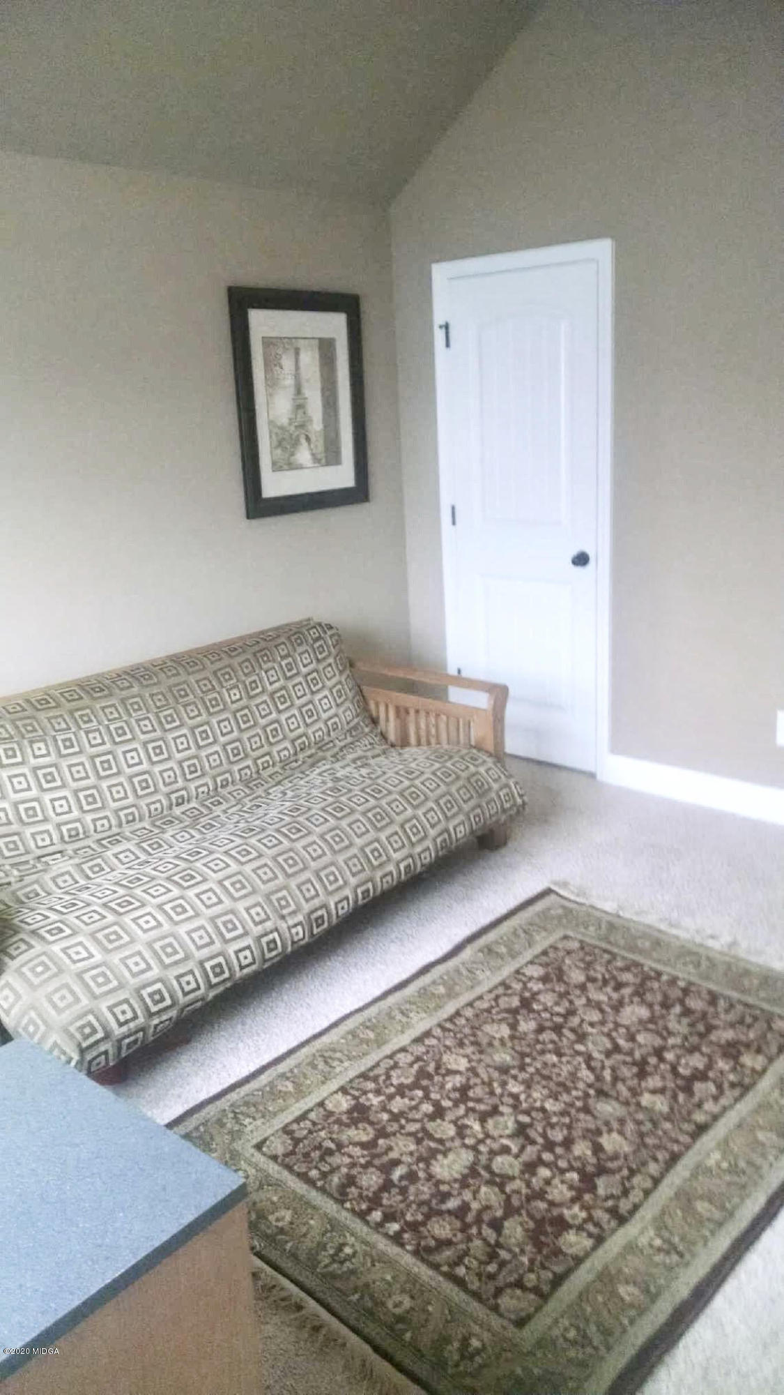203 Longbridge Way Perry, GA 31069 - Photo 31 of 31 a living room with a couch