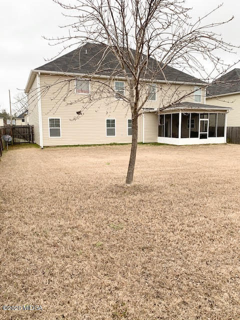 203 Longbridge Way Perry, GA 31069 - Photo 6 of 31 a house with trees in front of it