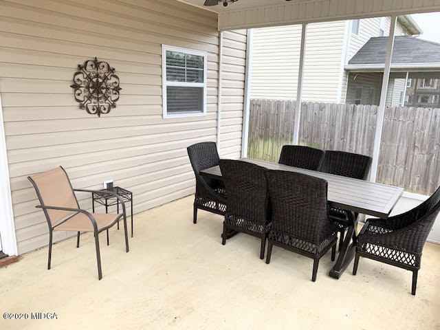 203 Longbridge Way Perry, GA 31069 - Photo 8 of 31 a view of a patio with a table and chairs