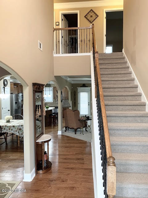 203 Longbridge Way Perry, GA 31069 - Photo 10 of 31 a view of a livingroom with furniture and staircase