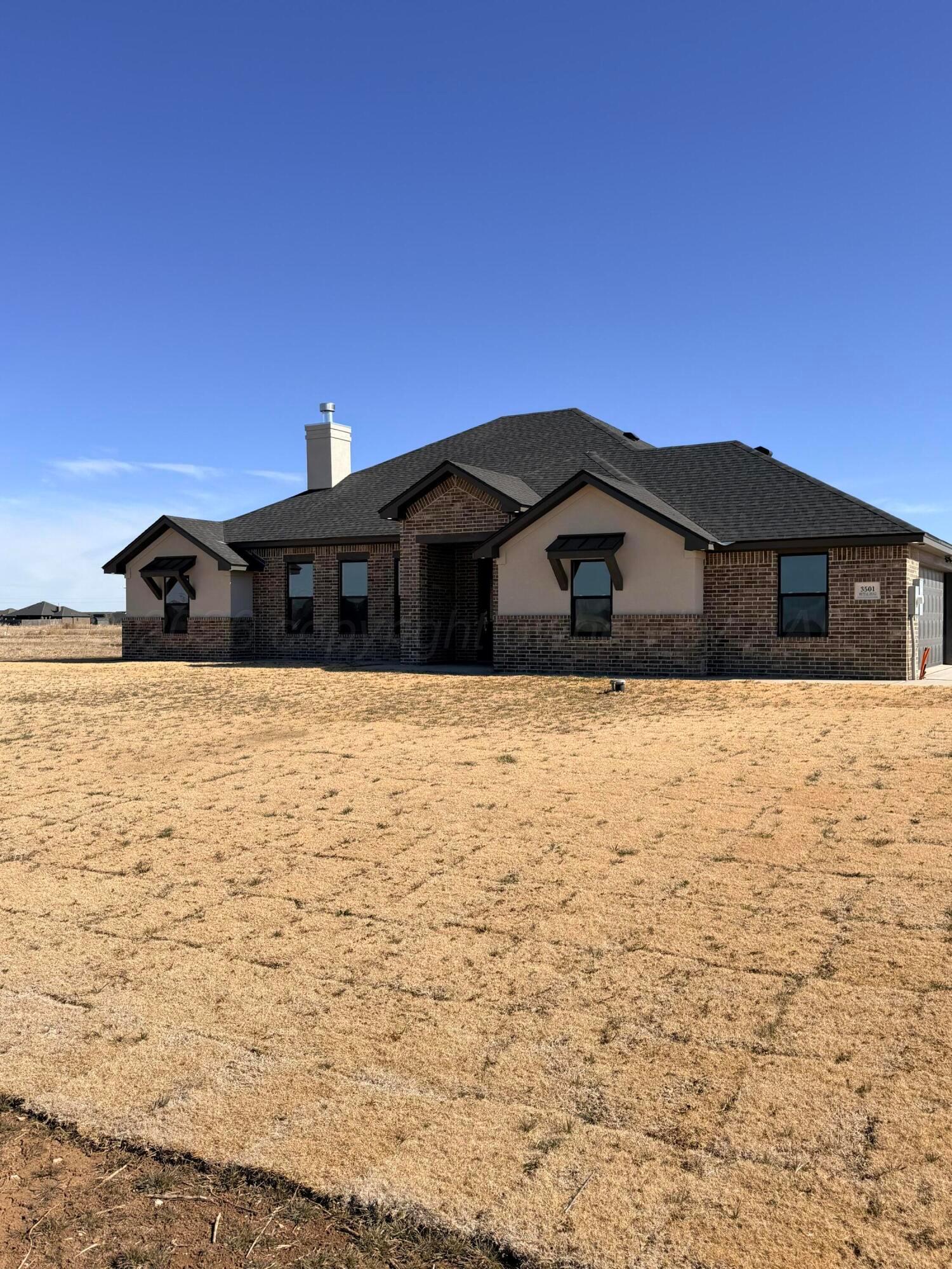 3501 Whitetail Springs Road Amarillo, TX 79119 - Photo 3 of 3 a large house with a large pool