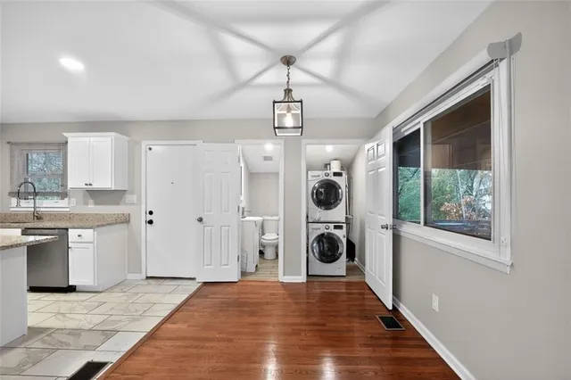 a view of a kitchen with a sink and a stove top oven