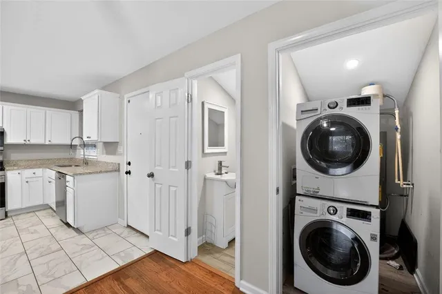 a view of a hallway with washer and dryer