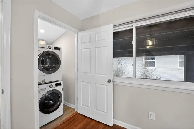 a utility room with sink dryer and washer