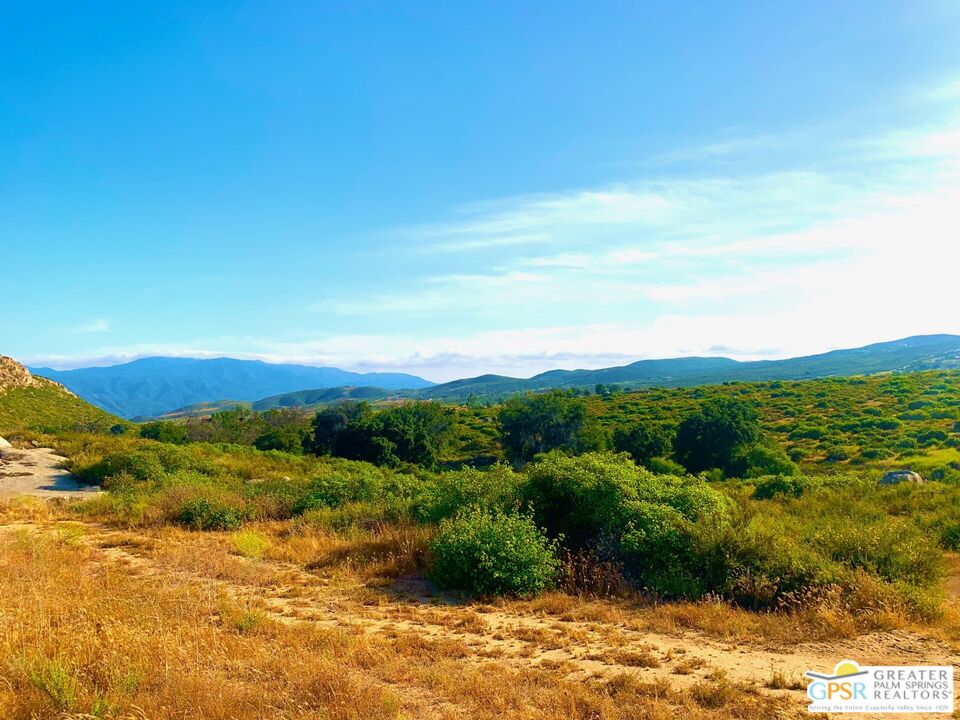 0 Serriano Road Hemet, CA 92544 - Photo 7 of 8 a view of a lake with mountains in the background