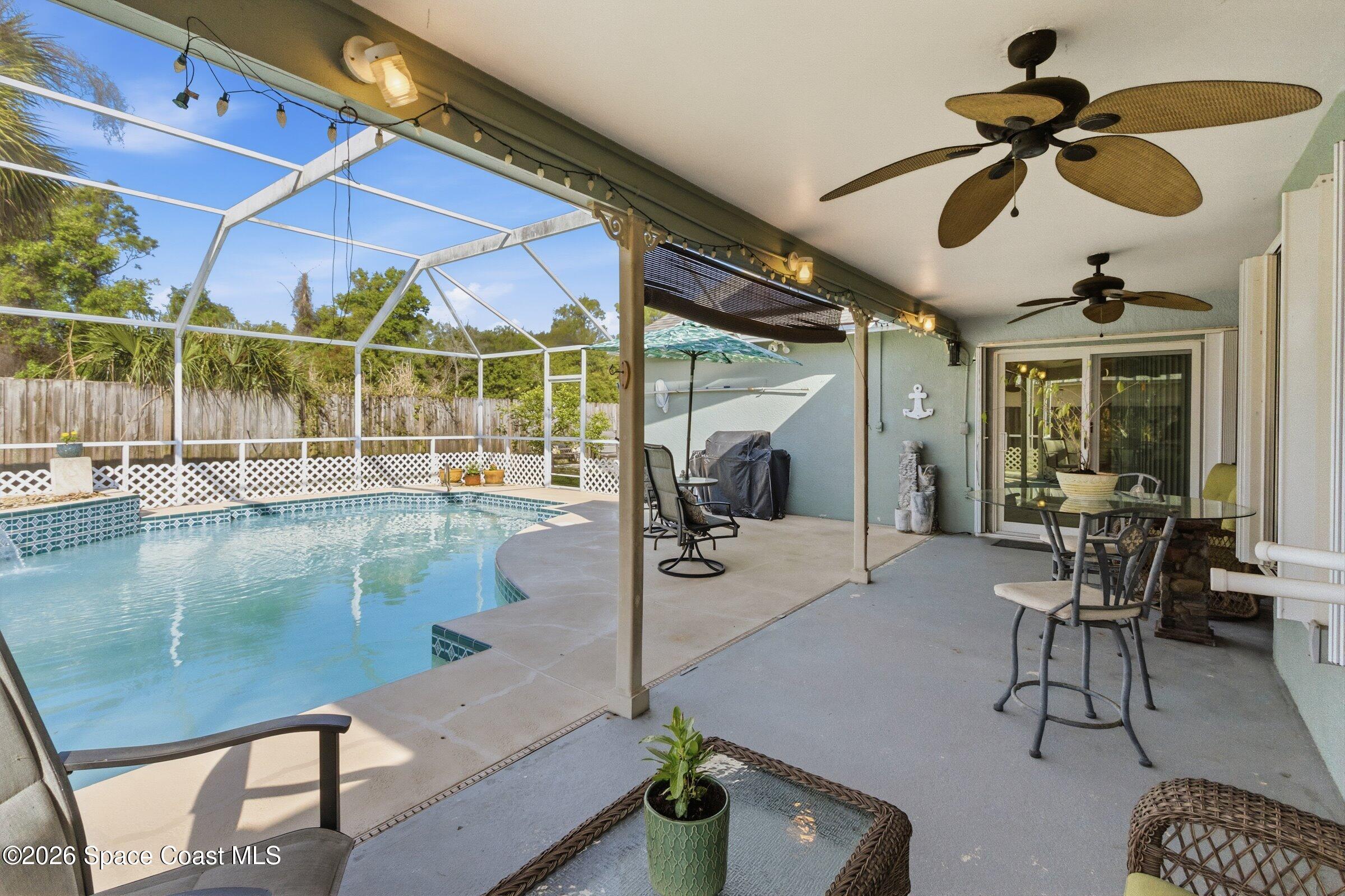 4770 Hidden Creek Road Palm Shores, FL 32935 - Photo 12 of 51 a view of a patio with table and chairs