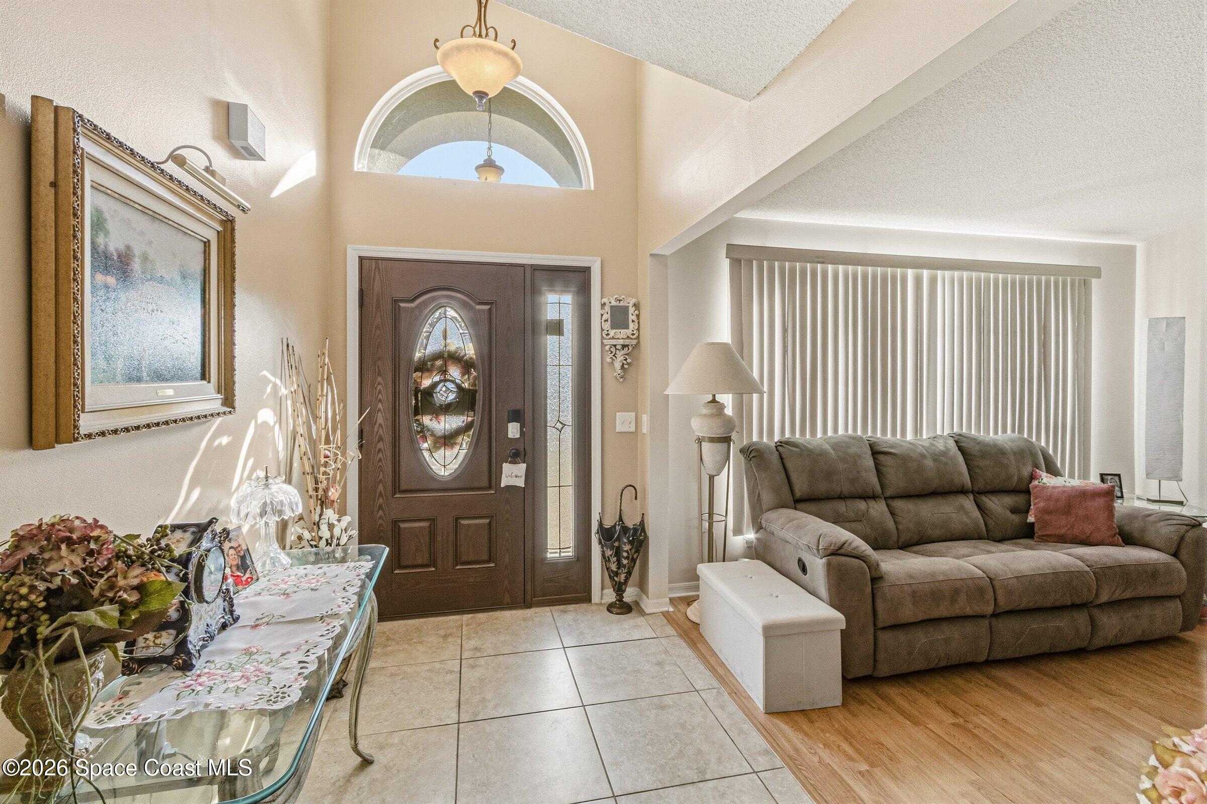 4770 Hidden Creek Road Palm Shores, FL 32935 - Photo 14 of 51 a living room with furniture and a window