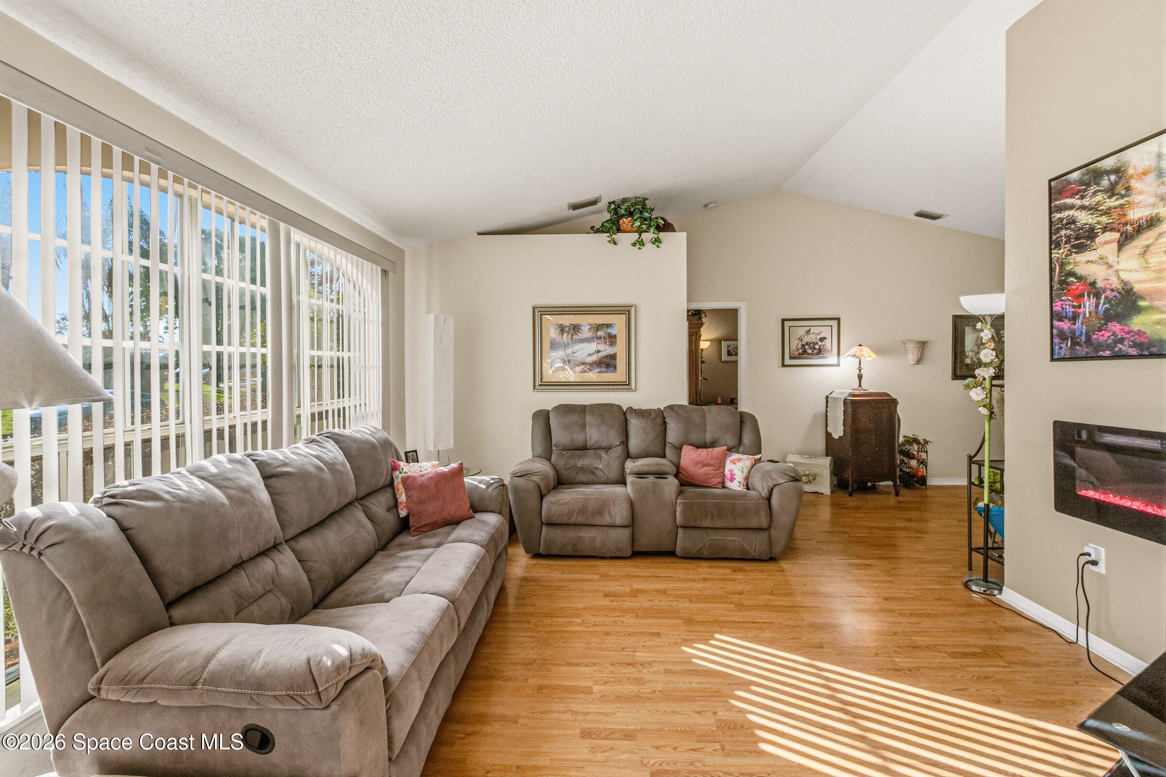 4770 Hidden Creek Road Palm Shores, FL 32935 - Photo 15 of 51 a living room with furniture or couch and a flat screen tv