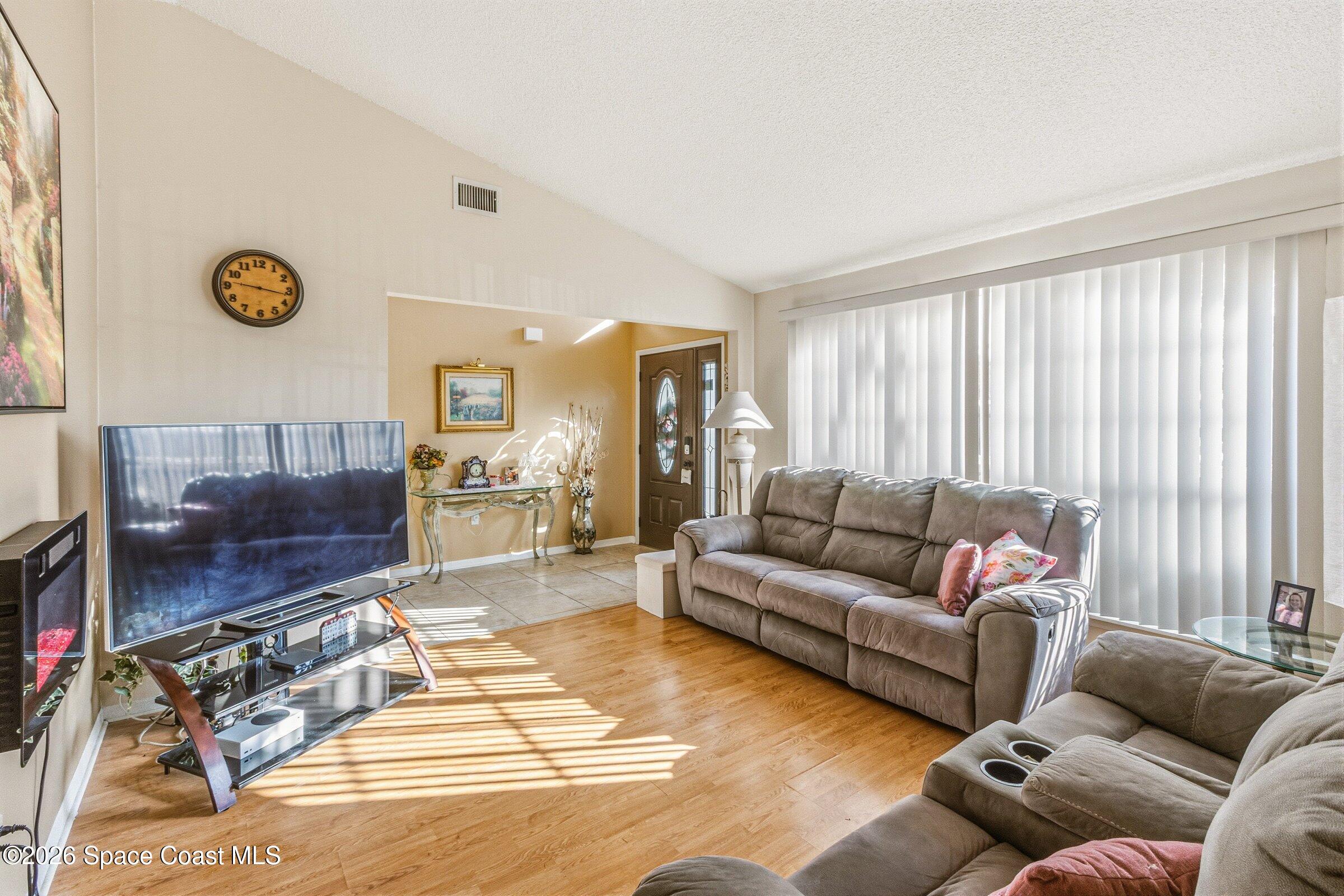 4770 Hidden Creek Road Palm Shores, FL 32935 - Photo 17 of 51 a living room with furniture and a flat screen tv