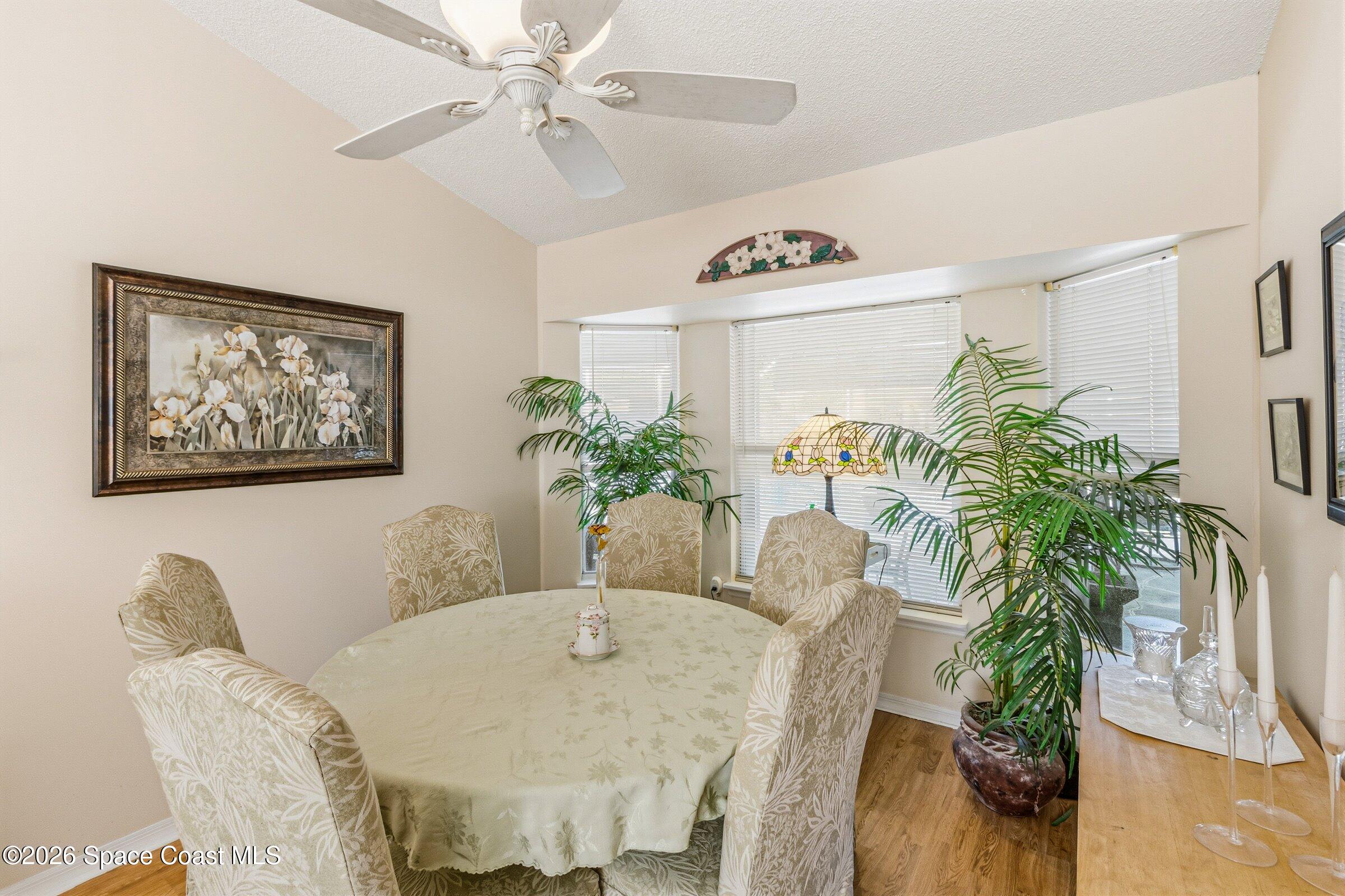 4770 Hidden Creek Road Palm Shores, FL 32935 - Photo 19 of 51 a view of a dining room with furniture and a potted plant