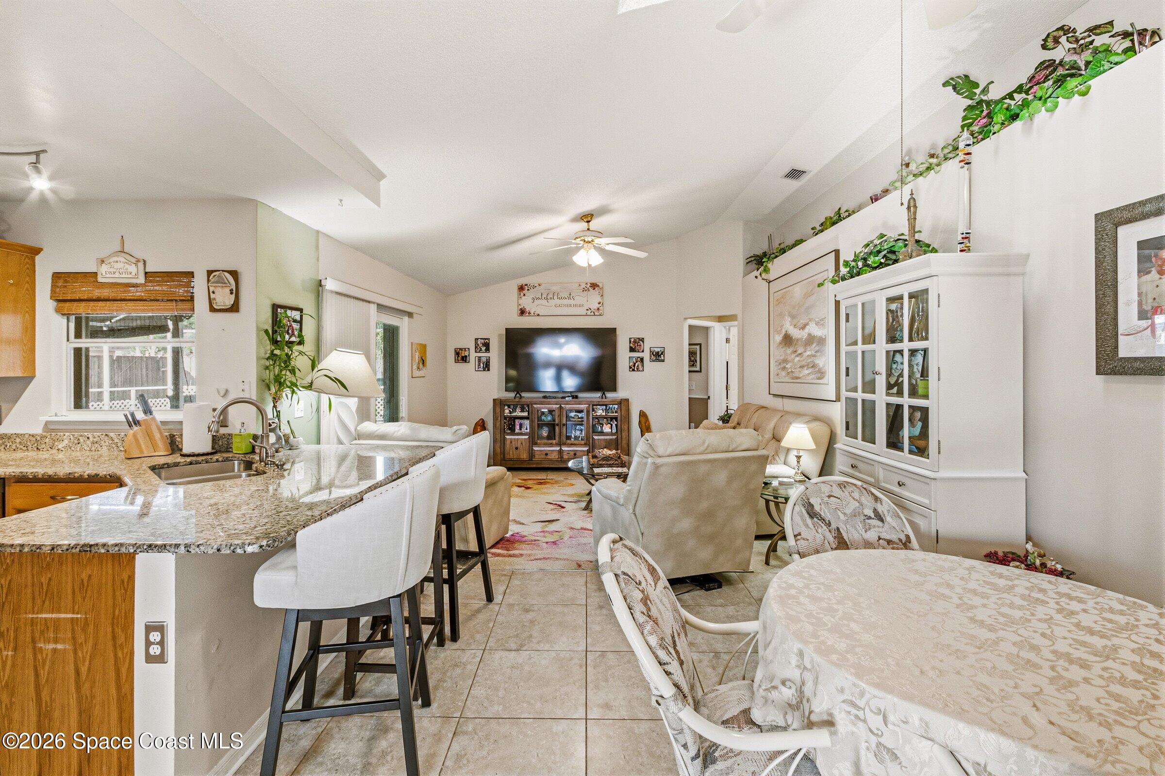 4770 Hidden Creek Road Palm Shores, FL 32935 - Photo 22 of 51 a view of a dining room with furniture window and outside view