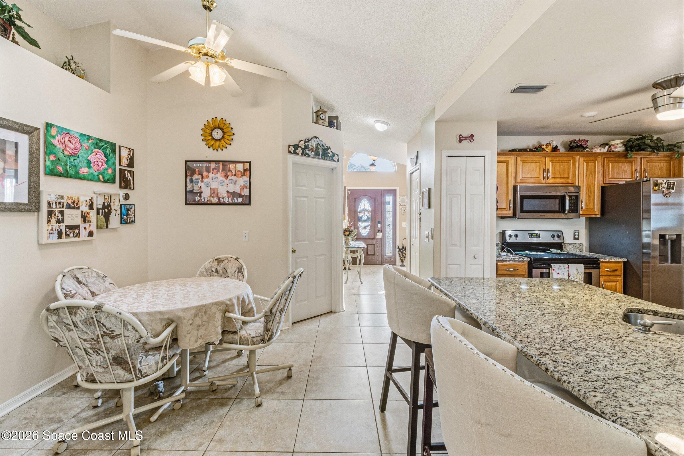 4770 Hidden Creek Road Palm Shores, FL 32935 - Photo 24 of 51 a dining table with chairs and window