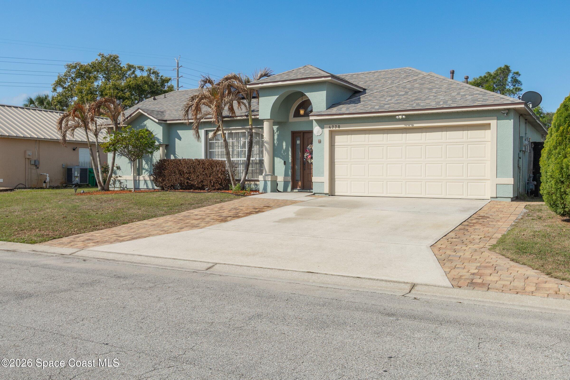 4770 Hidden Creek Road Palm Shores, FL 32935 - Photo 3 of 51 front view of a house with a outdoor space