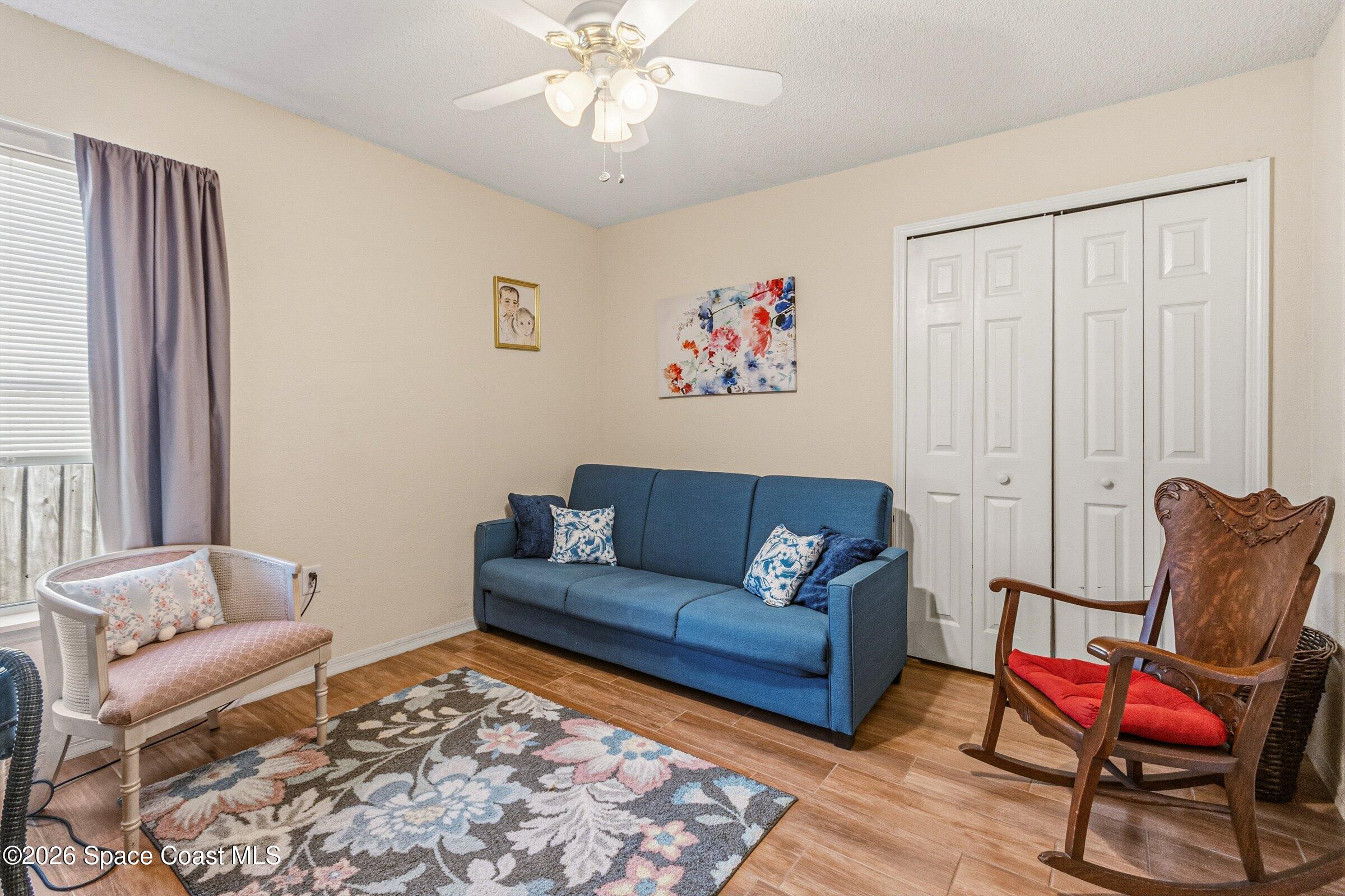 4770 Hidden Creek Road Palm Shores, FL 32935 - Photo 32 of 51 a living room with furniture and a rug