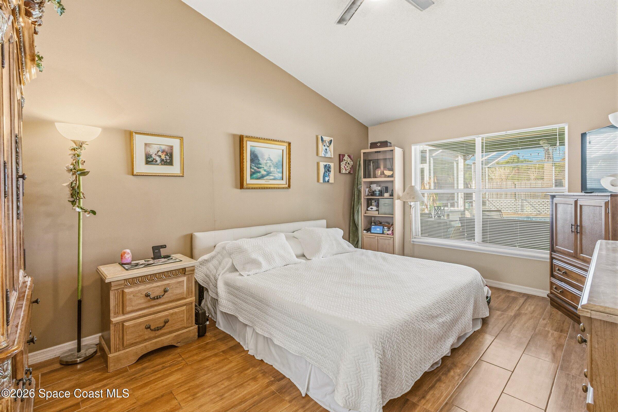 4770 Hidden Creek Road Palm Shores, FL 32935 - Photo 34 of 51 a bedroom with a bed and a large window