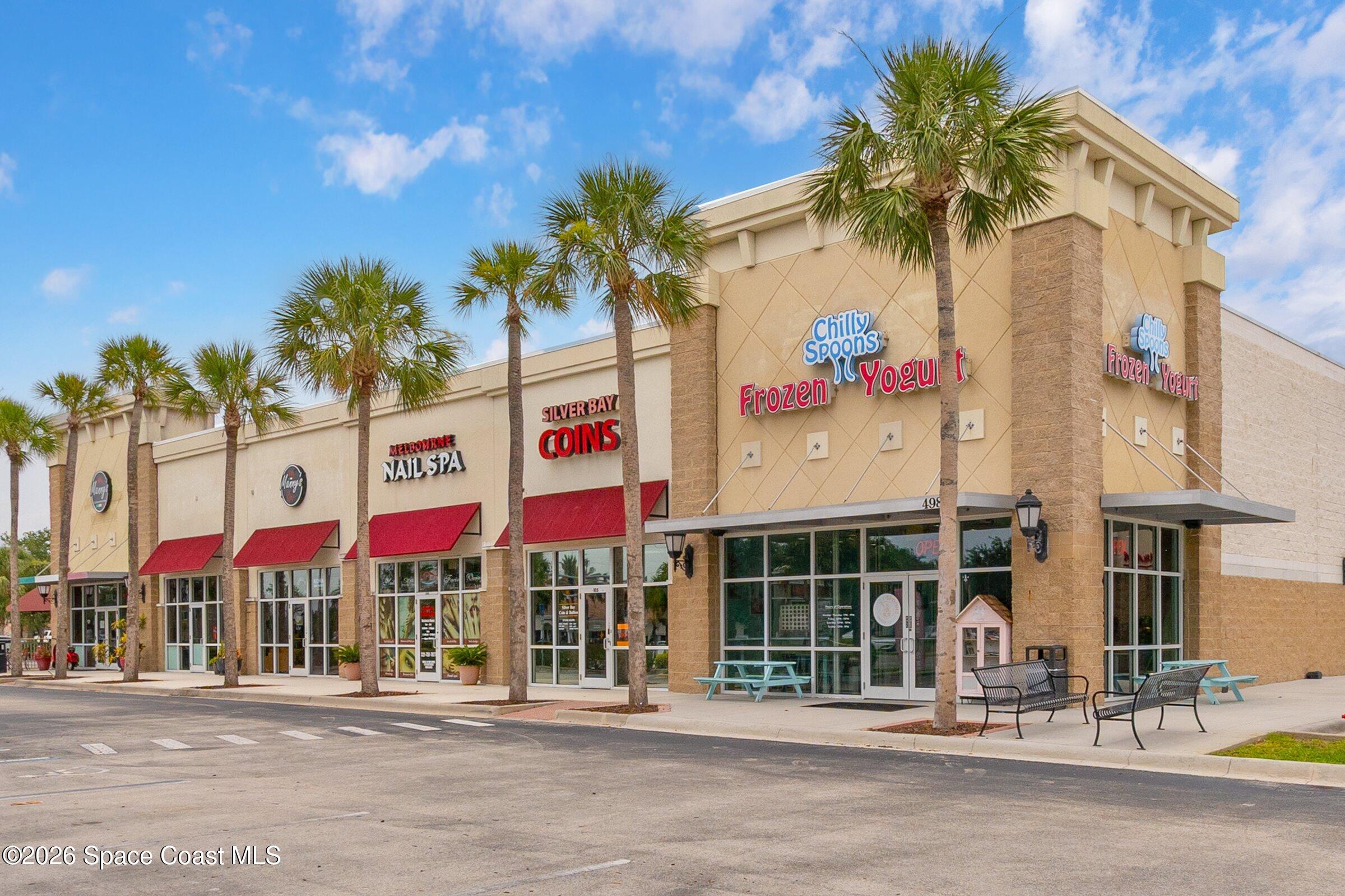 4770 Hidden Creek Road Palm Shores, FL 32935 - Photo 47 of 51 a view of a building with a street