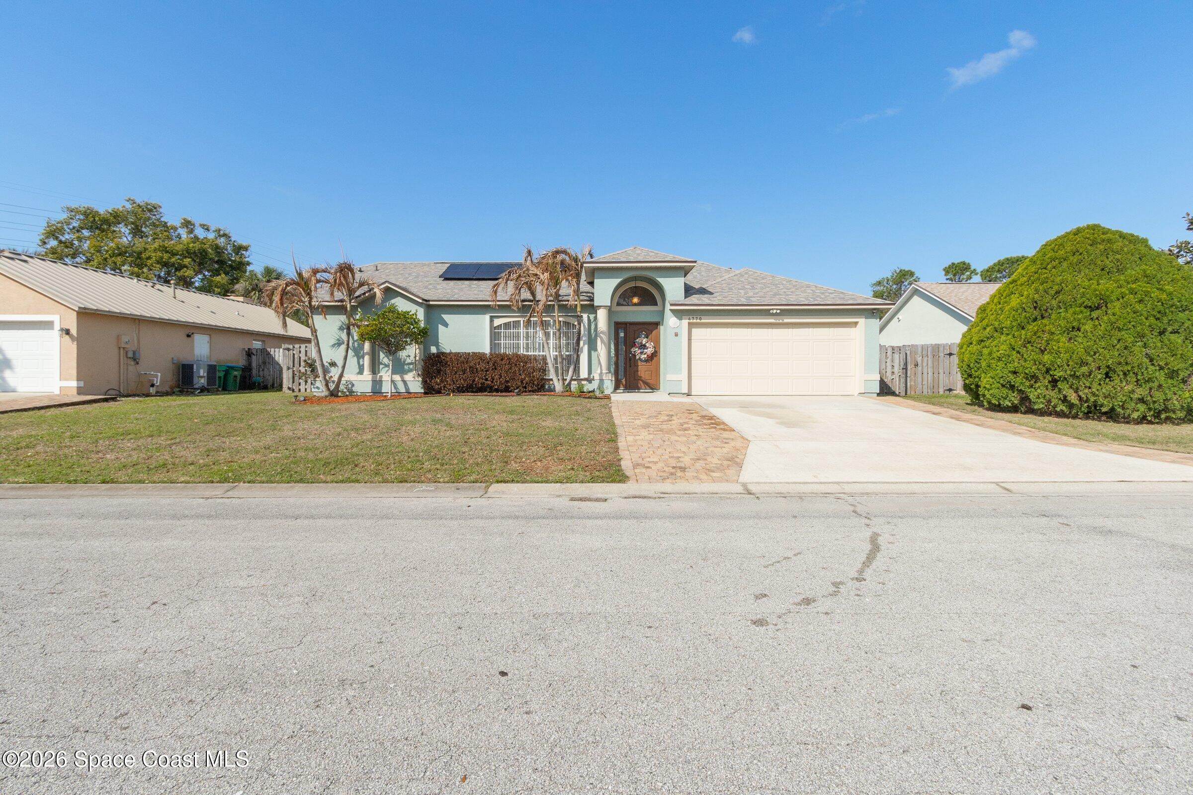 4770 Hidden Creek Road Palm Shores, FL 32935 - Photo 5 of 51 front view of a house with a street
