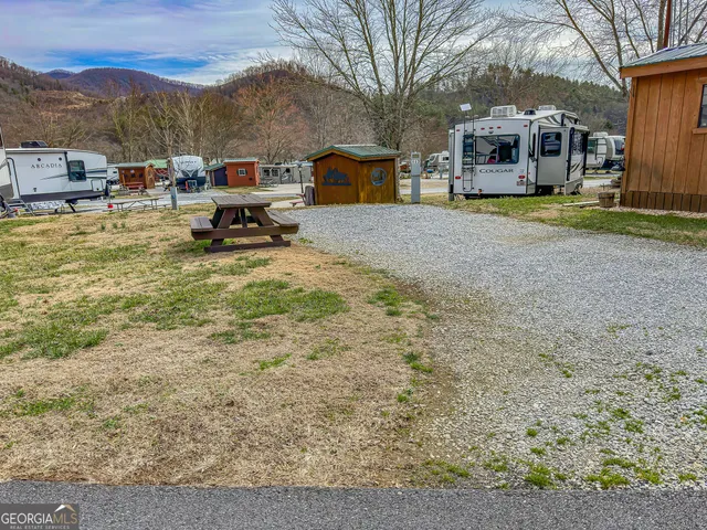 a view of a house with backyard porch and sitting area