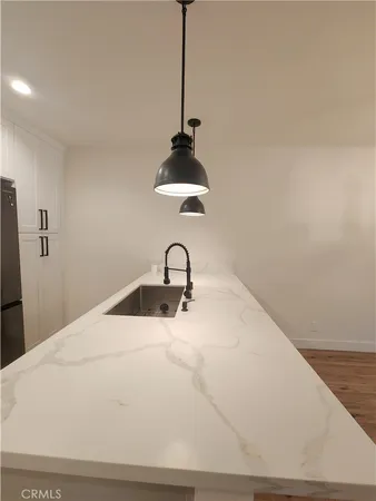a white sink sitting in a bathroom