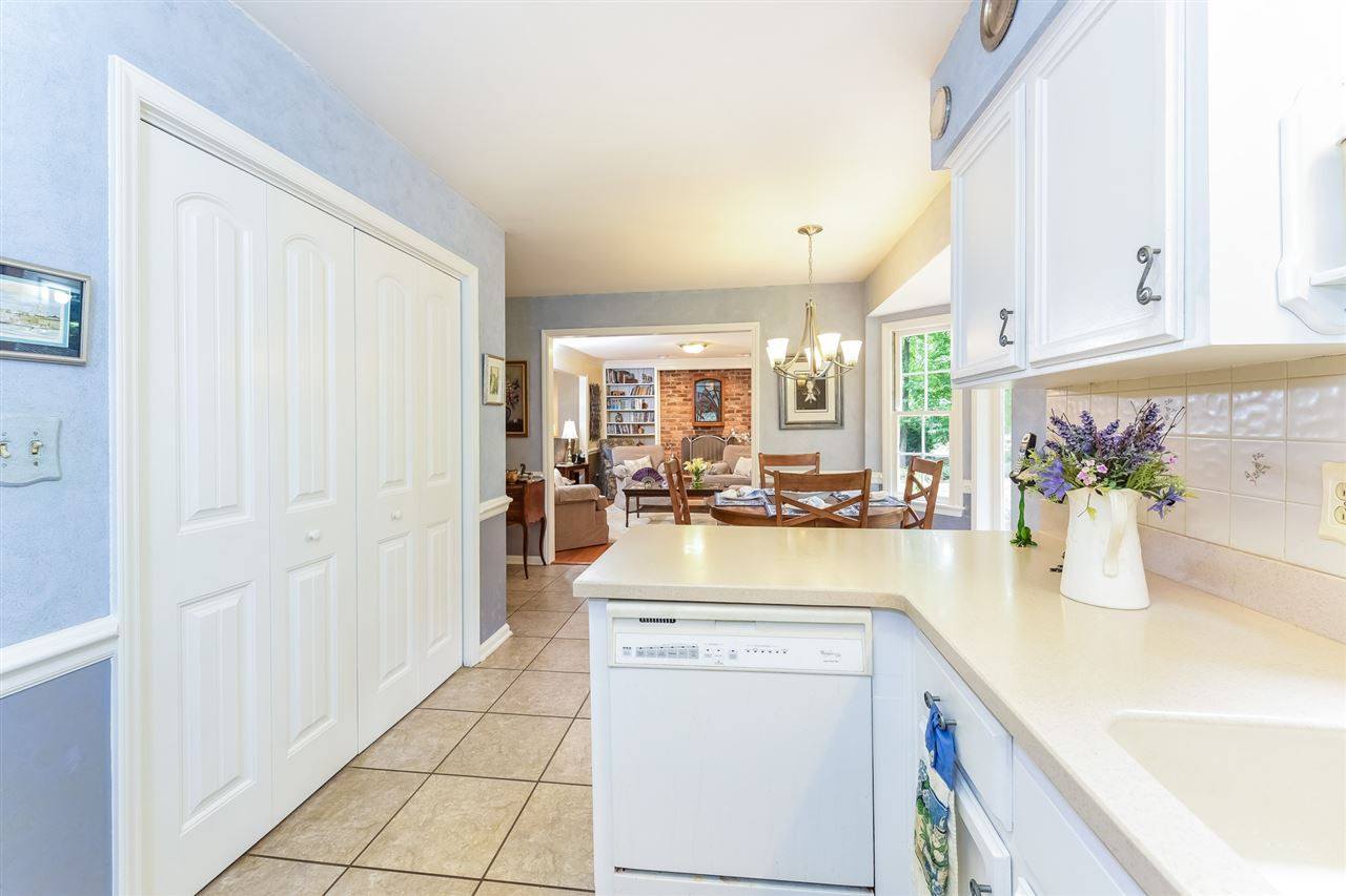 9716 Rock Creek Road Raleigh, NC 27613 - Photo 14 of 25 Kitchen with Breakfast Area & Family Room in Background