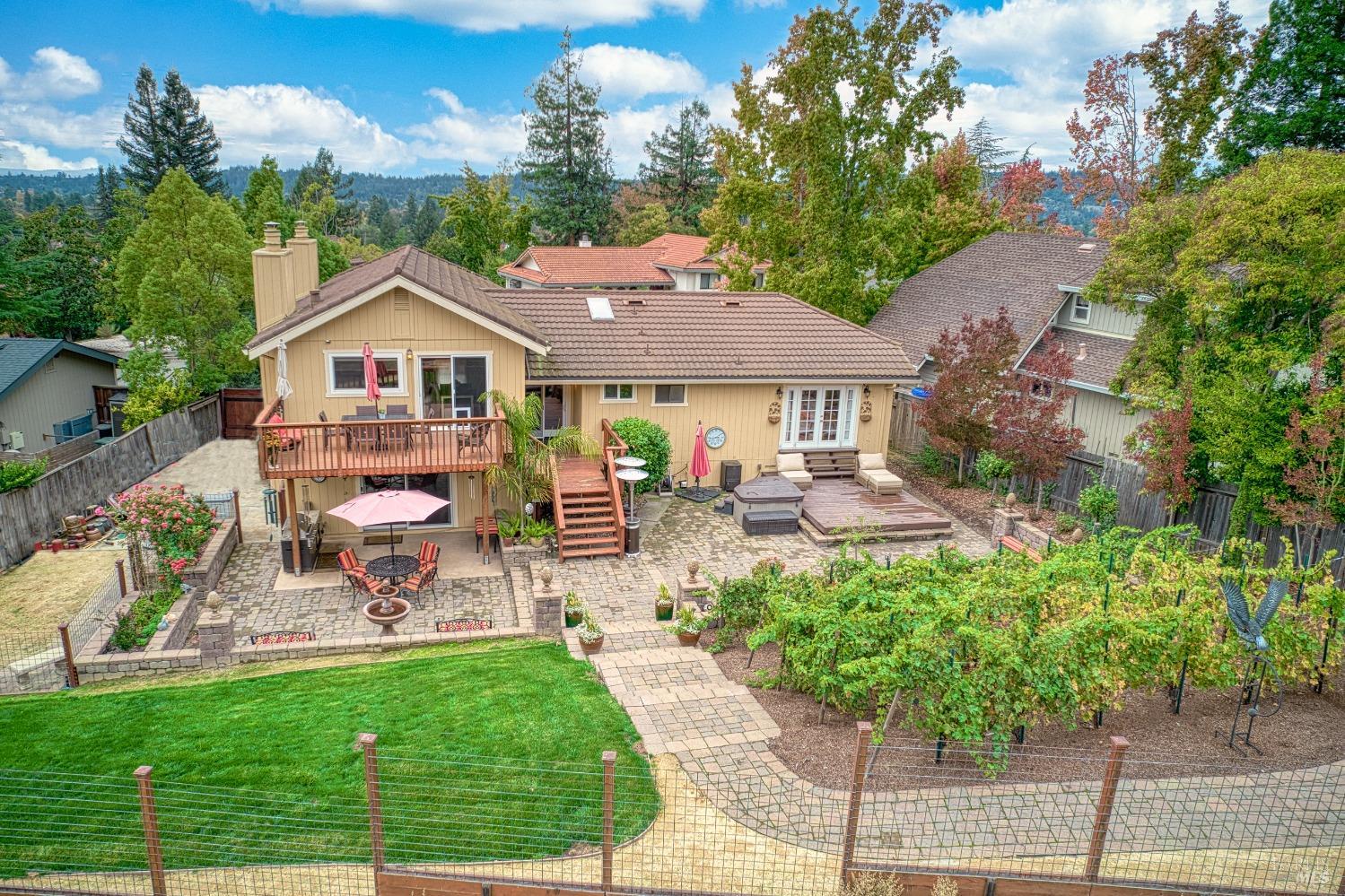 616 Rinaldo Street Santa Rosa, CA 95409 - Photo 1 of 1 a view of a patio with table and chairs and potted plants