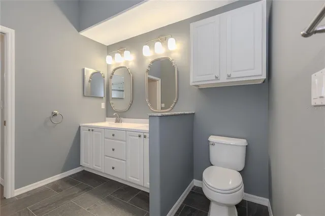 a bathroom with a shower and a mirror