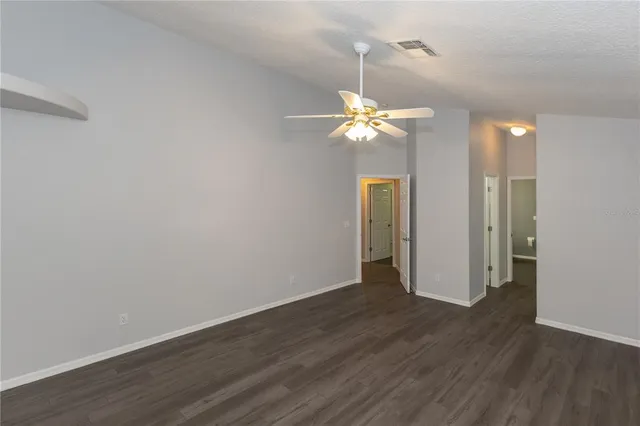 a kitchen with granite countertop a sink stove and cabinets