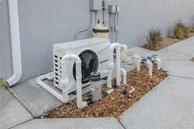 a bathroom with a granite countertop sink and cabinets