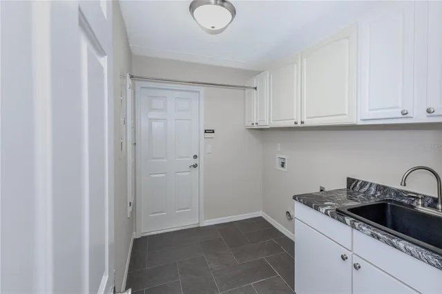 a house that has a tree in front of it