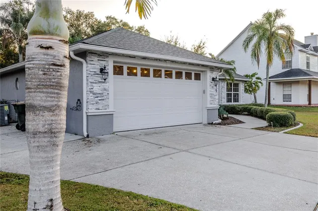 an aerial view of a house with lots of residential buildings