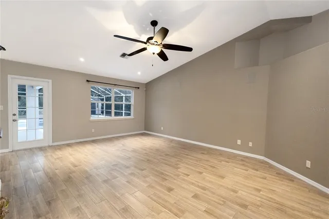 a bathroom with a granite countertop sink a toilet and shower