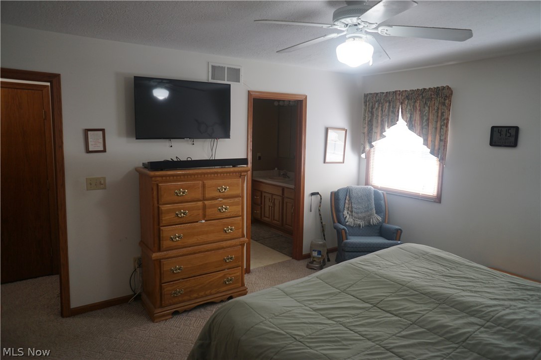 4220 Baird Road Stow, OH 44224 - Photo 9 of 21 Master Bedroom leading to Master Bathroom