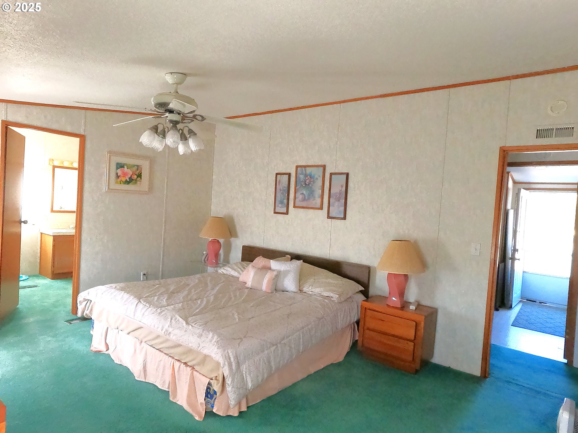 12705 Southwest Airfield Lane Culver, OR 97734 - Photo 14 of 20 a bedroom with a bed and a chandelier