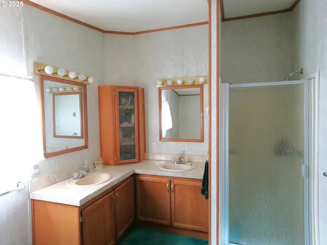 a bathroom with a toilet a sink and a window
