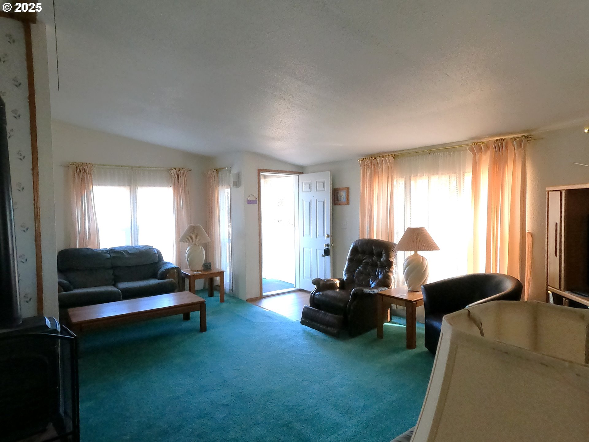 12705 Southwest Airfield Lane Culver, OR 97734 - Photo 7 of 20 a living room with furniture windows and a flat screen tv