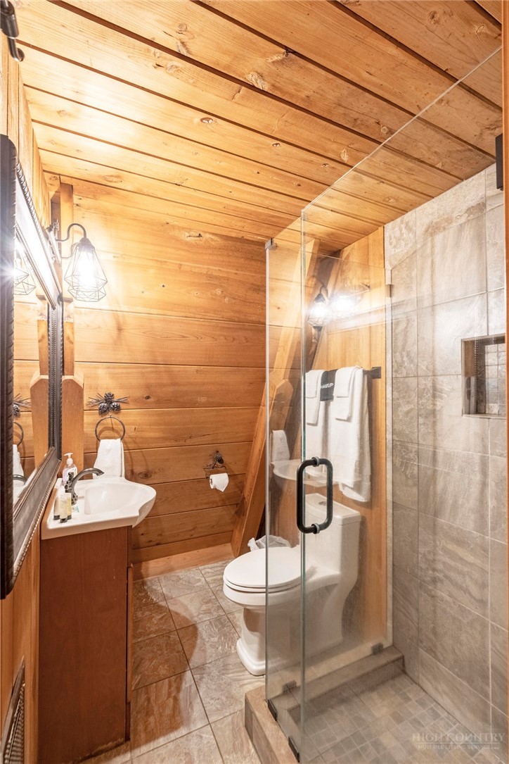 268 Cherry Drive Boone, NC 28607 - Photo 21 of 29 a bathroom with a mirror and shower