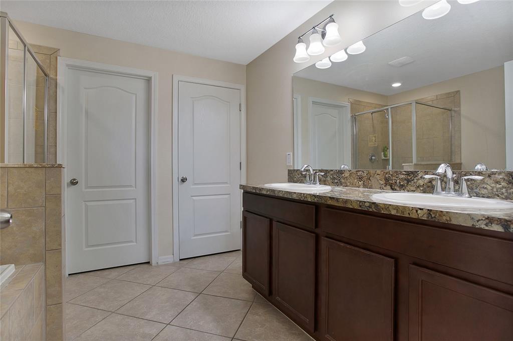 3216 Rodrick Circle Orlando, FL 32824 - Photo 13 of 33 a bathroom with a sink and a mirror
