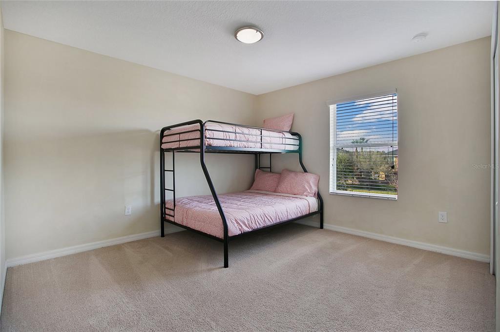 3216 Rodrick Circle Orlando, FL 32824 - Photo 17 of 33 a bedroom with a bed and window